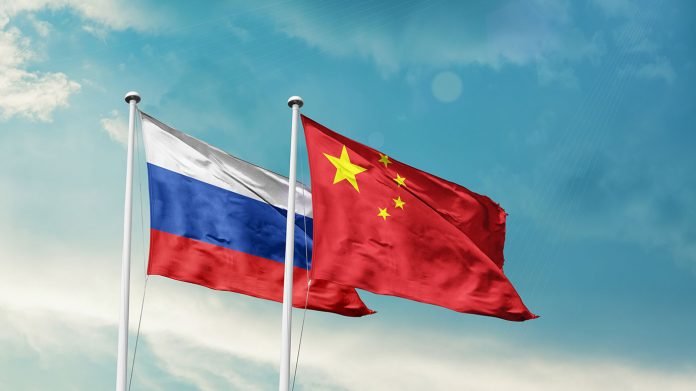 Russia china flags 696x391
